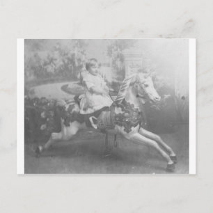 child on carousel horse postcard