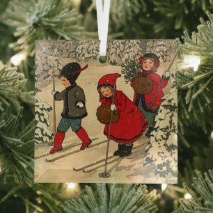 Children skiing, a vintage winter scene glass tree decoration