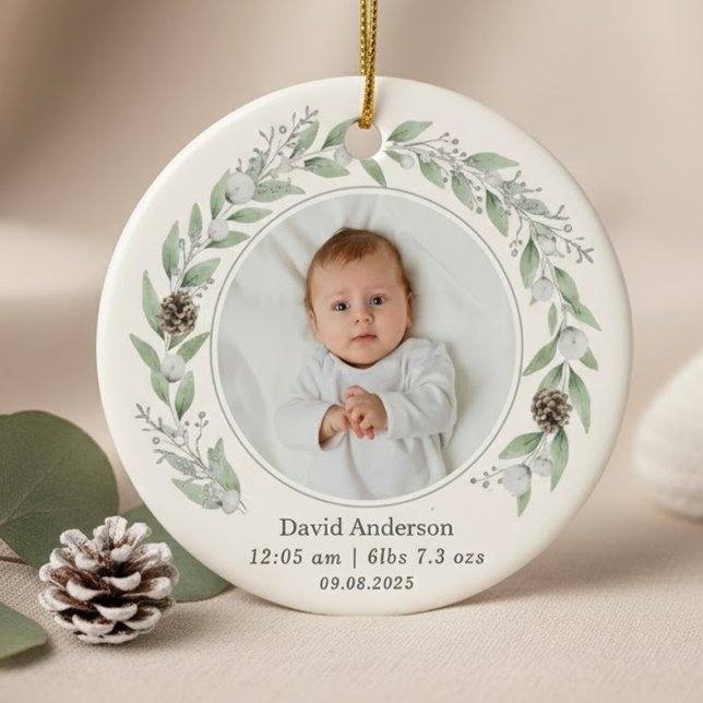Child's Photo Holly Wreath Christmas 2025  Ceramic Ornament (A round ornament featuring a central baby photo circled by a delicate watercolor greenery wreath.)