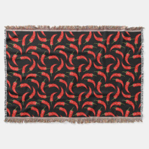 Chili peppers on black throw blanket