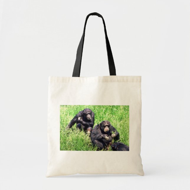 Chimpanzees eating grass (note infant) tote bag (Front)
