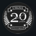 China Traditional wedding anniversary 20 years Large Clock<br><div class="desc">A design to celebrate 20 years of marriage. This design has a white (china) coloured laurel design on a black background. China is the traditional gift for this occasion. The text reads china 20 years anniversary. A romantic design to celebrate your 20th year of marriage. If you would like any...</div>