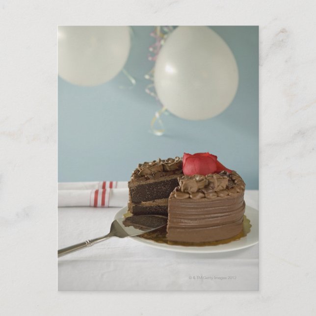 Chocolate cake with missing slice on table, postcard (Front)