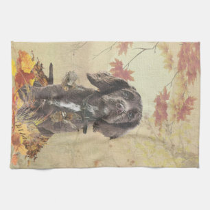 Chocolate cocker spaniel puppy     tea towel