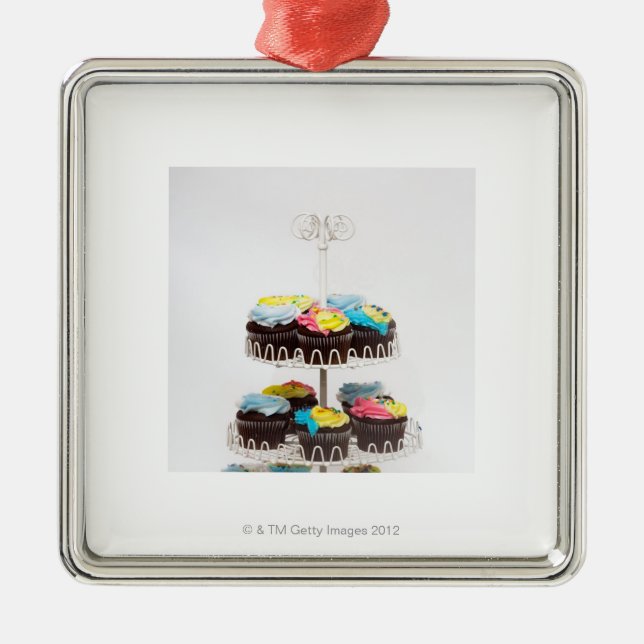 Chocolate cupcakes on a cake stand metal ornament (Front)