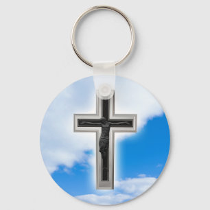 Christian cross at blue sky background key ring