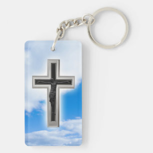 Christian cross at blue sky background key ring