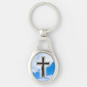 Christian cross at blue sky background key ring