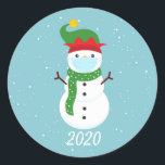 Christmas 2020 Face Mask Snowman Quarantine Classic Round Sticker<br><div class="desc">This design was created though digital art.  It may be personalised 

Contact me at colorflowcreations@gmail.com if you with to have this design on another product.  

Purchase my original abstract acrylic painting for sale at www.etsy.com/shop/colorflowart.   See more of my creations or follow me at www.facebook.com/colorflowcreations,  www.instagram.com/colorflowcreations,  www.twitter.com/colorflowart,  and www.pinterest.com/colorflowcreations.</div>