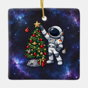 Christmas Astronaut Decorating a Moon Tree Ceramic Ornament
