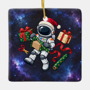 Christmas Astronaut Wrapping Gifts in Space Ceramic Ornament