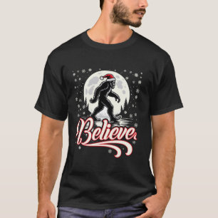 Christmas Bigfoot Believe Santa Hat Moon Scene Fes T-Shirt