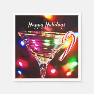 Christmas candy cane on cocktail party glass napkin