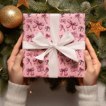 Christmas Candy Canes and Bows Wrapping Paper<br><div class="desc">"Add a touch of classic holiday cheer to every gift with our Christmas Candy Canes and Bows Wrapping Paper. Featuring a festive pattern of red-and-white candy canes paired with elegant pink bows, this design captures the joyful spirit of the season in a timeless and playful way. Printed on high-quality, durable...</div>