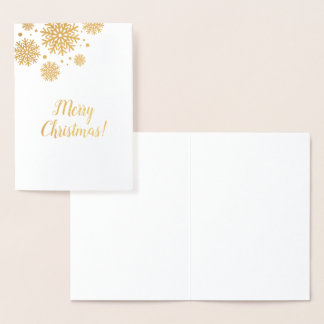 Christmas card with gold snowflakes and text.