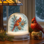 Christmas Cardinals Winter  Snowglobe<br><div class="desc">Create lasting memories with this Christmas cardinals winter snow globe. The artwork features a digital watercolor illustration of a pair of red cardinals perched on a fir tree branch with pine cones. An overlay of snowflakes adds to the winter design. Anyone who loves songbirds will appreciate this snow globe as...</div>