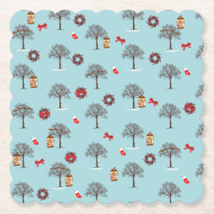 Christmas decorations and trees under snow paper coaster