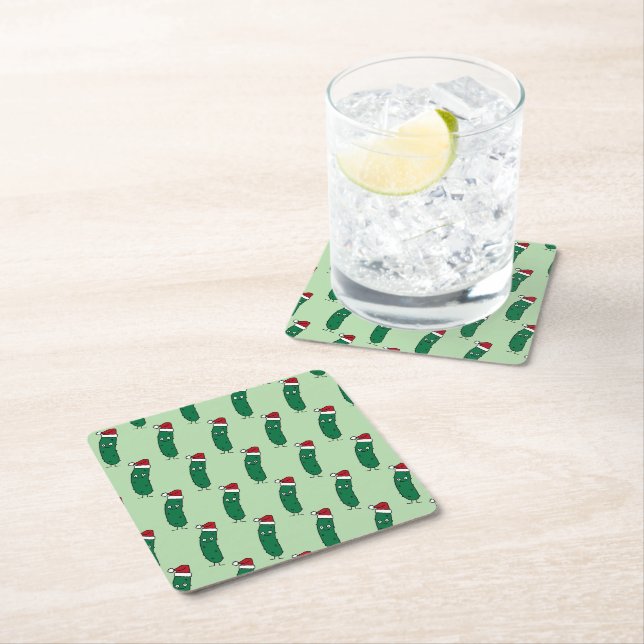 Christmas Dill Pickle wearing a Santa Hat Square Paper Coaster (Insitu)