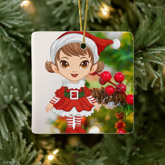 Christmas Elf Ceramic Square Ornament (Elf is dressed in a festive red and white outfit, stands against a backdrop of a decorated tree.)