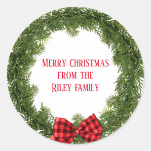 Christmas evergreen wreath with plaid bow classic round sticker