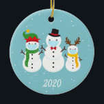 Christmas Face Mask Snowman Family 2020 Ceramic Ornament<br><div class="desc">This design was created though digital art. It may be personalised in the area provided or customising by changing the photo or added your own words. Contact me at colorflowcreations@gmail.com if you with to have this design on another product. Purchase my original abstract acrylic painting for sale at www.etsy.com/shop/colorflowart. See...</div>