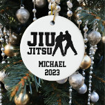 Christmas Jiu Jitsu Personalised  Ceramic Ornament<br><div class="desc">This design was created though digital art. It may be personalised in the area provided or customising by changing the photo or added your own words. Contact me at colorflowcreations@gmail.com if you with to have this design on another product. See more of my creations or follow me at www.facebook.com/colorflowcreations, www.instagram.com/colorflowcreations,...</div>