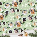 Christmas Joy Snowflake Photo Collage Green Wrapping Paper<br><div class="desc">'Wishing you joy' fun and stylish gift wrap! An editable template, personalised with six photos of your family, friends or pets. You can also include the recipient's name, your family name or the holiday year. A seamless pattern with snowball framed photographs, festive leaves, berries, snow, snowflakes and stars. Custom gift...</div>