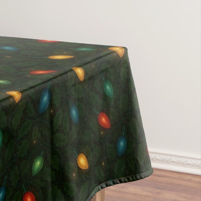 Christmas lights wrapped in holly leaves patterned tablecloth (In Situ)
