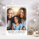 Christmas Merry Bright Photo Holiday Card<br><div class="desc">Modern Christmas holiday greeting card featuring your photo,  "Merry & Bright" in elegant typography and your family name and the year in simple typography.</div>