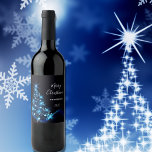 Christmas party black blue modern shining tree wine label<br><div class="desc">A trendy and modern Christmas dinner party wine label in black, blue and white. A black background with a shining glittery blue Christmas tree decorated wiht stars. With the text: Merry Christmas written with modern and trendy large white hand lettered style script. Templates for your family name and a year....</div>