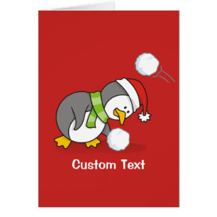 Christmas penguin getting a snow ball