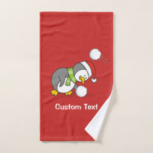 Christmas penguin getting a snow ball bath towel set