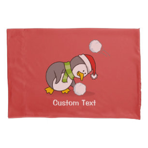 Christmas penguin getting a snow ball pillowcase