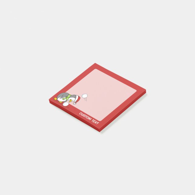 Christmas penguin getting a snow ball post-it notes (Angled)