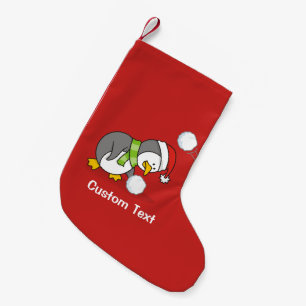 Christmas penguin getting a snow ball small christmas stocking