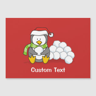 Christmas penguin sitting with snow balls