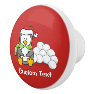 Christmas penguin sitting with snow balls ceramic knob