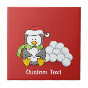 Christmas penguin sitting with snow balls ceramic tile