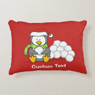 Christmas penguin sitting with snow balls decorative cushion
