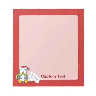 Christmas penguin sitting with snow balls notepad