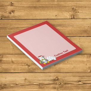 Christmas penguin sitting with snow balls notepad