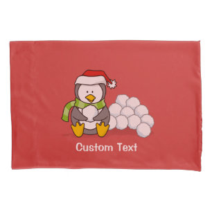 Christmas penguin sitting with snow balls pillowcase