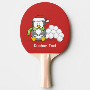 Christmas penguin sitting with snow balls ping pong paddle