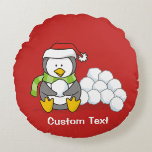 Christmas penguin sitting with snow balls round cushion