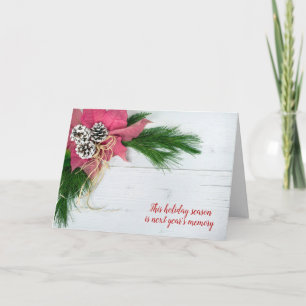 Christmas poinsettia and pine on wood holiday card