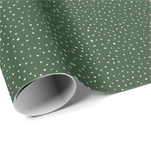 Christmas polka dot cream on forest green wrapping paper