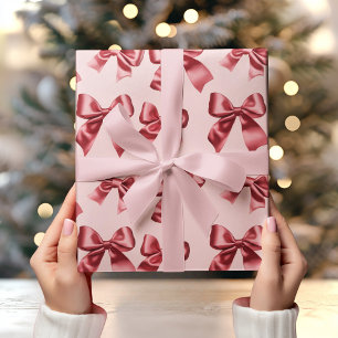 Christmas Red Bow on Pink Background Wrapping Paper