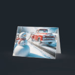 Christmas Red Retro Truck With Snowman Holiday Card<br><div class="desc">A cheerful snowman stands beside a road as a vintage red truck drives by in a snowy landscape</div>