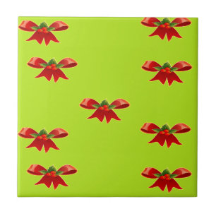 Christmas red ribbon on bright green ceramic tile