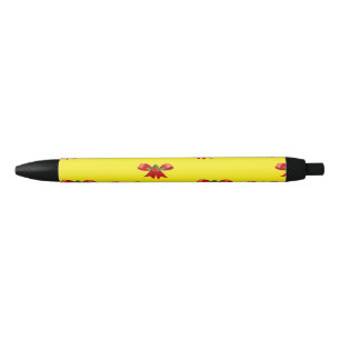 Christmas red ribbon on yellow black ink pen